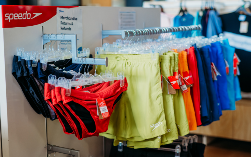 Range of men's Speedo swimwear displayed including swim trunks, and board shorts