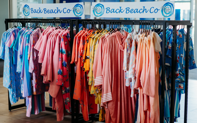 in-store display of Back Beach branded towel robes