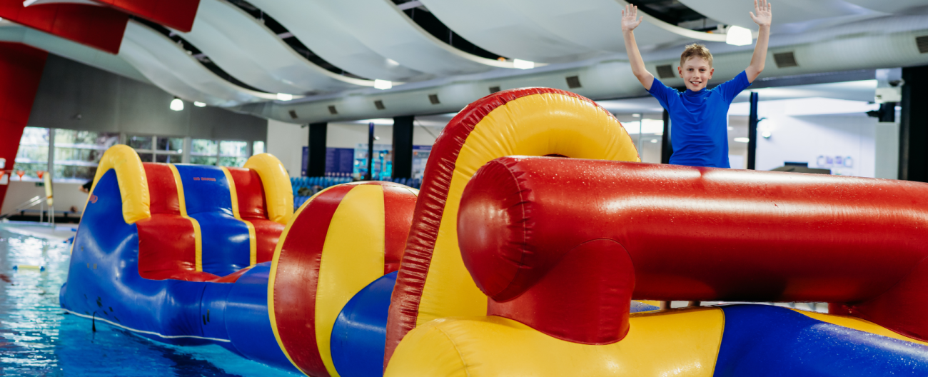 image of boy on inflatables at aqualink nunawading