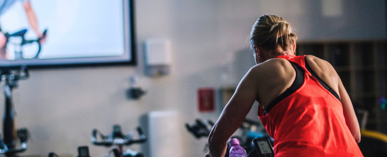 Women riding on a spin bike